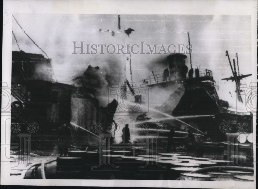 1947 Press Photo Genoa Harbor Fireman Pour Water on Flames - nee11257
