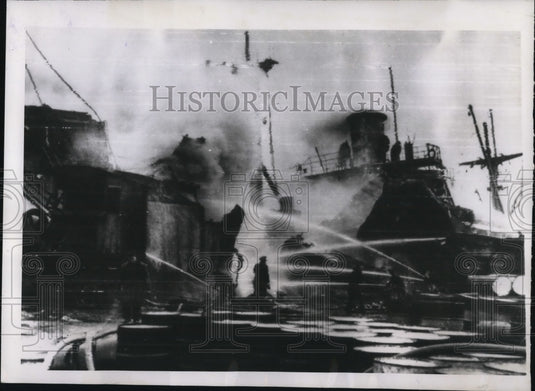 1947 Press Photo Genoa Harbor Fireman Pour Water on Flames - nee11257