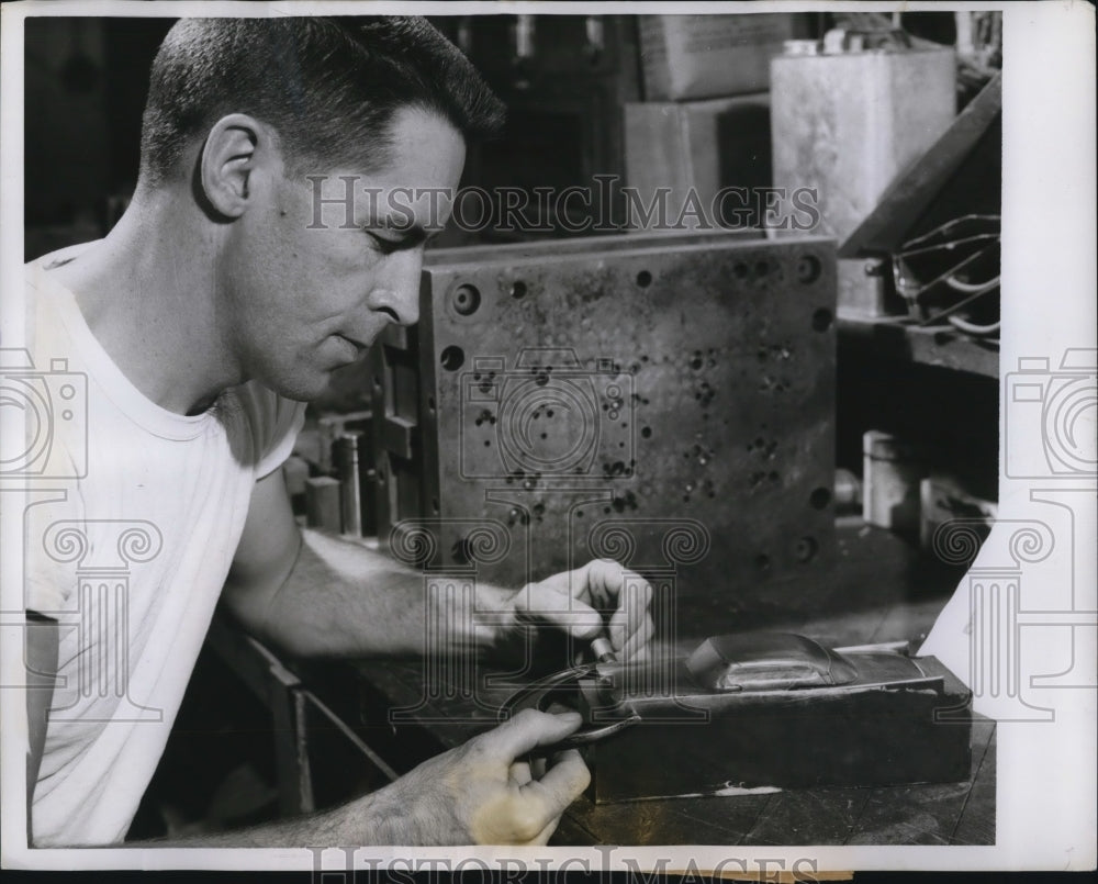1958 Press Photo Worker using a Micrometer to check Model - nee11264
