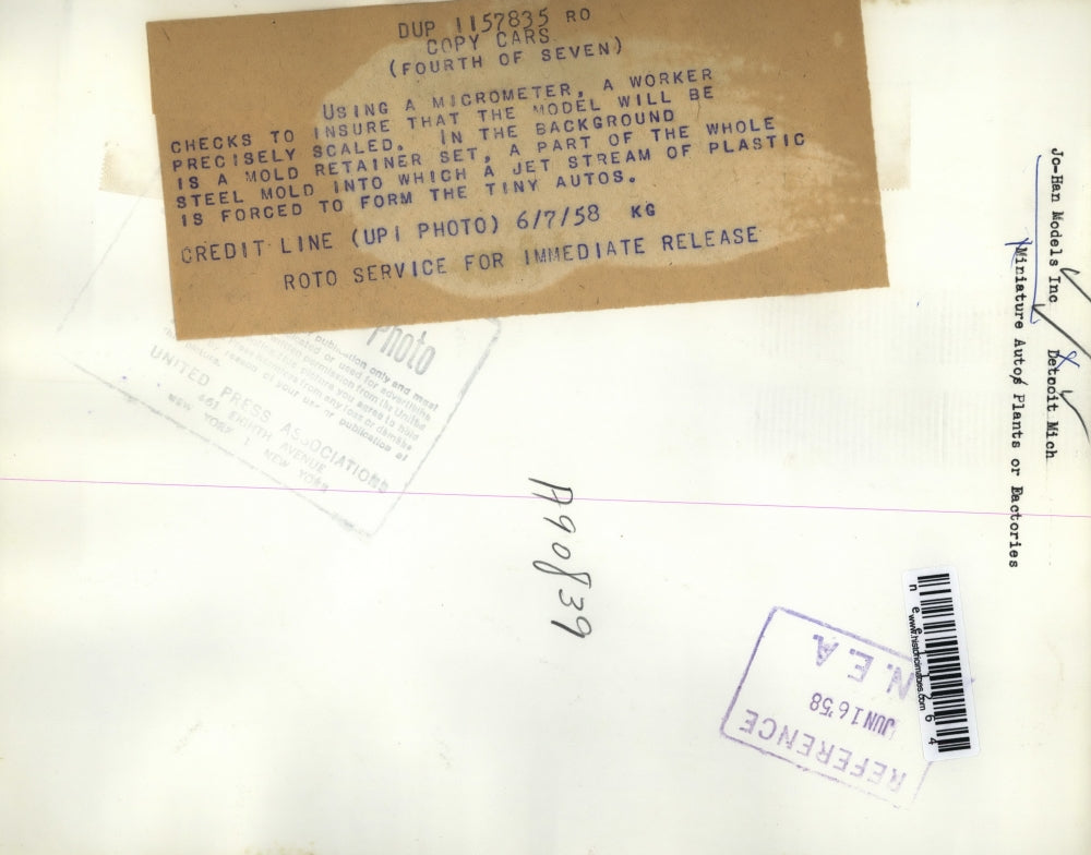 1958 Press Photo Worker using a Micrometer to check Model - nee11264