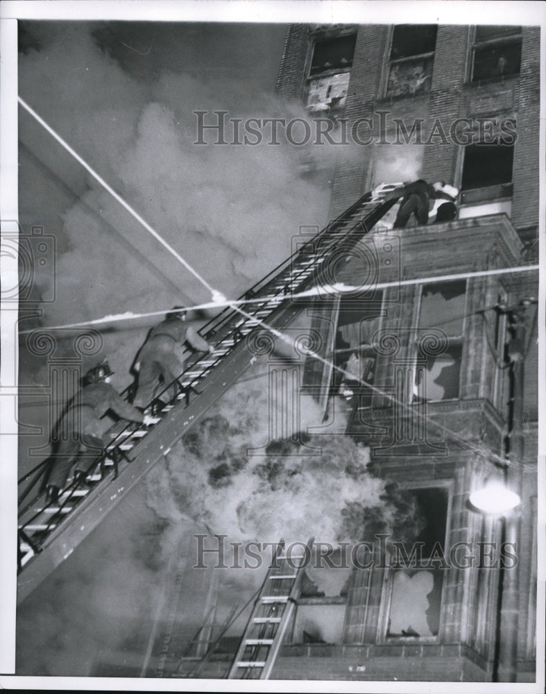 Load image into Gallery viewer, 1955 Press Photo Firefighters Rescue Resident From Fire Comfort Hotel Chicago
