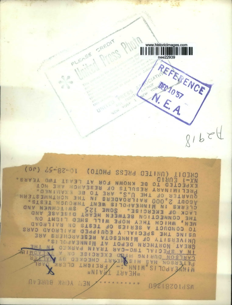 1957 Press Photo Carl Peterson is being check by Walter Carlson on a treadmill