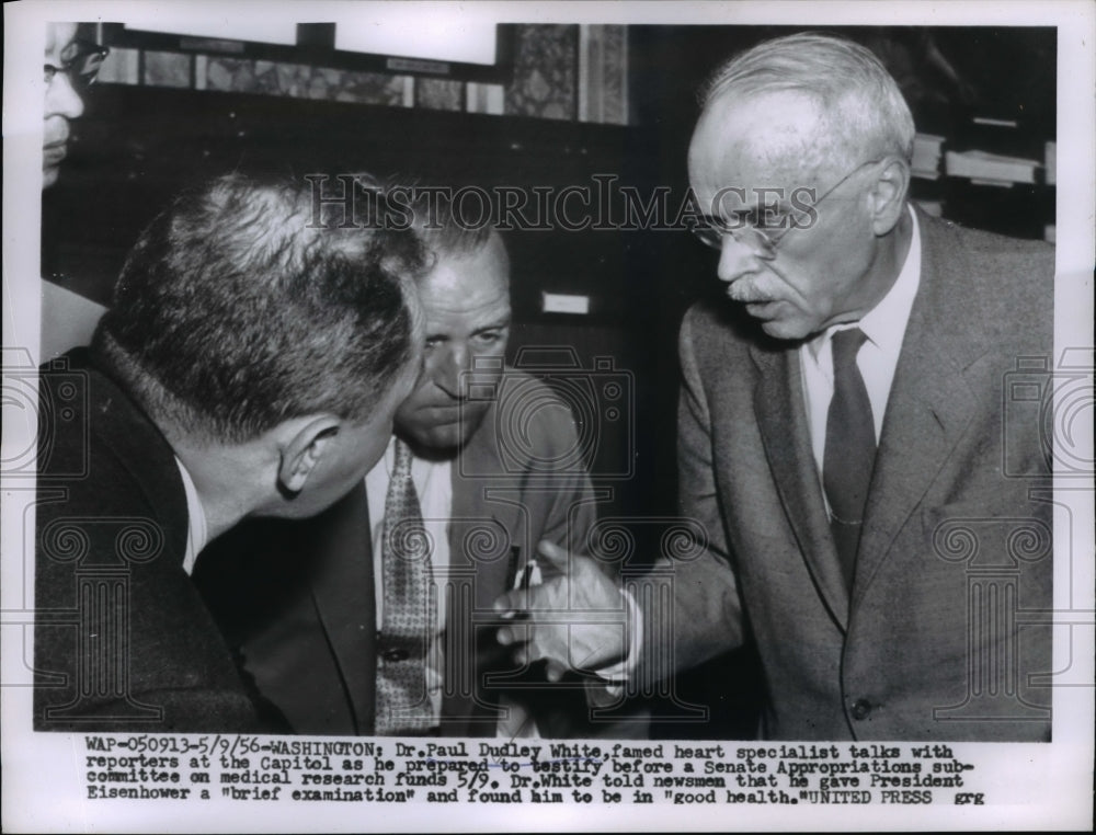 1956 Press Photo Dr. Paul Dudley White talks with reporters rat Capitol