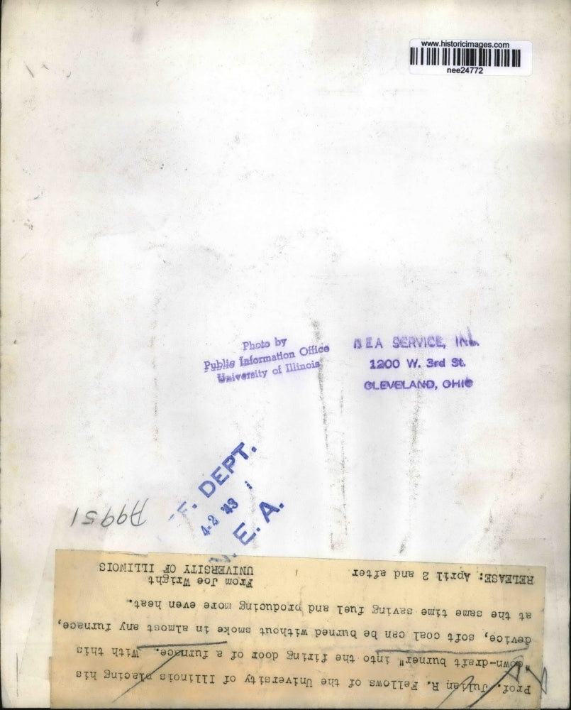 1943 Press Photo Prof. Julian R. Fellows places down draft burner into furnace