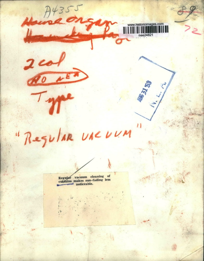 1953 Press Photo The regular vacuum cleaning of curtains - nee24821