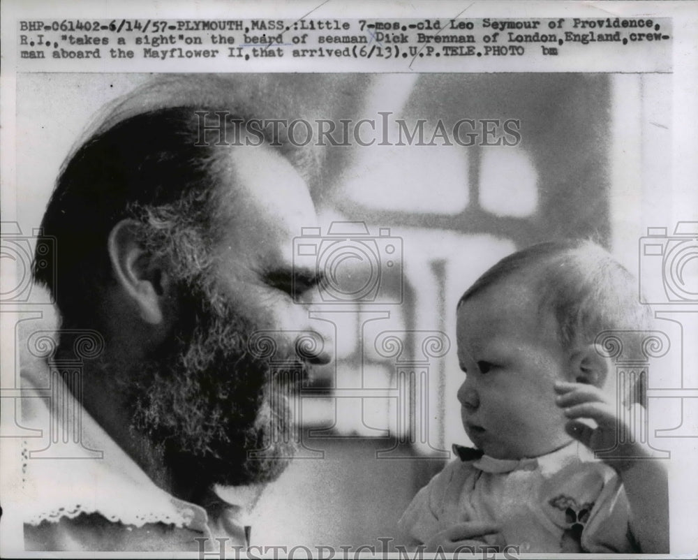 1957 Press Photo Sailor Dick Brennan Holds Baby Leo Seymour - nee25417