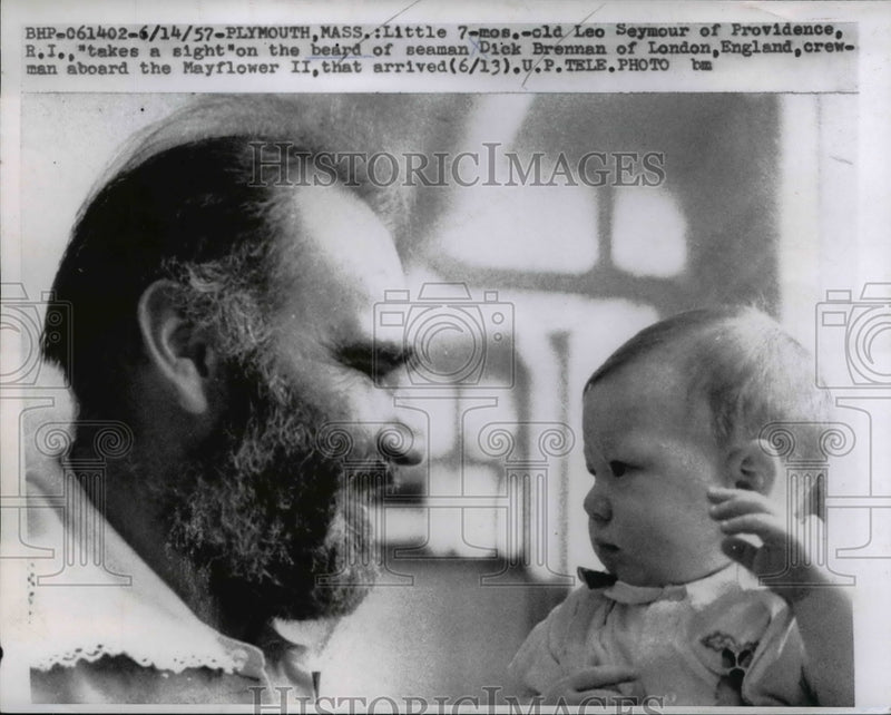Load image into Gallery viewer, 1957 Press Photo Sailor Dick Brennan Holds Baby Leo Seymour - nee25417
