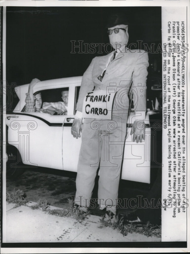 Load image into Gallery viewer, 1959 Press Photo James Dixon &amp; Geroge Olah Hang Effigy of Frank Carbo
