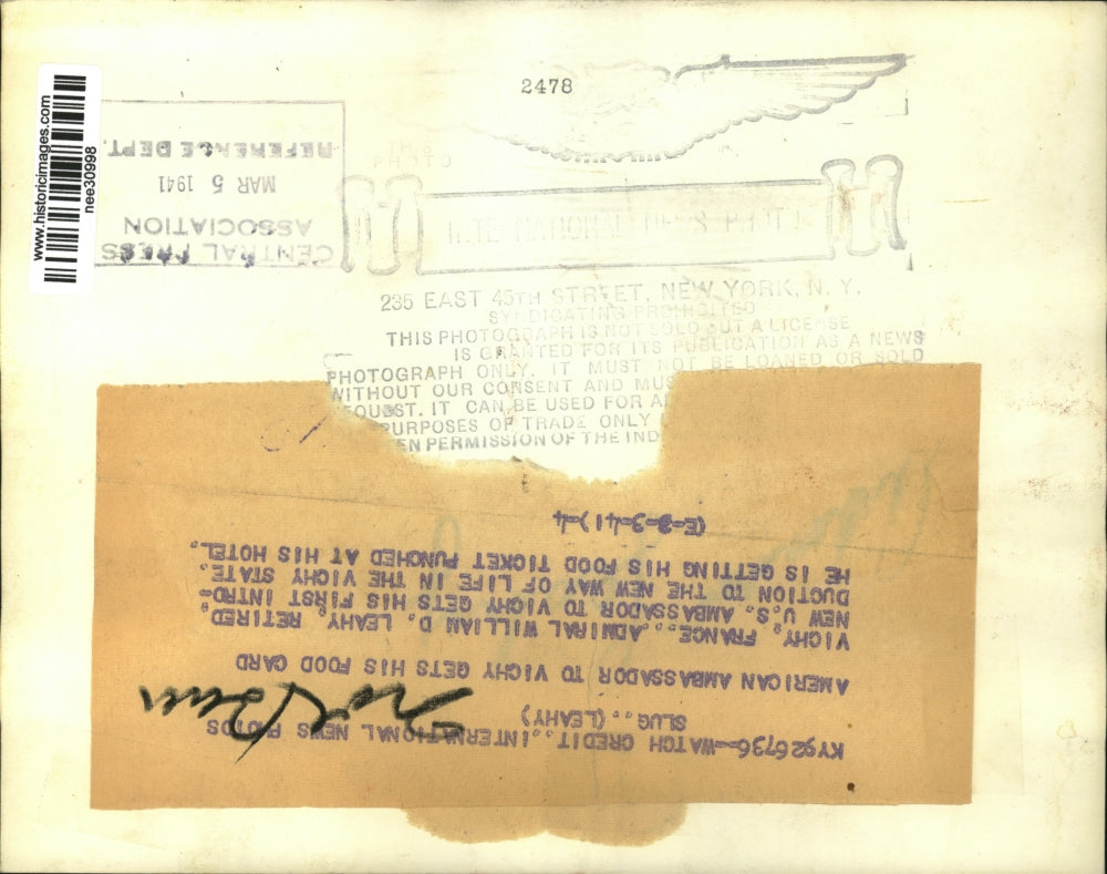 1941 Press Photo William D. Leahy get hotel food ticket punched, Vichy, France