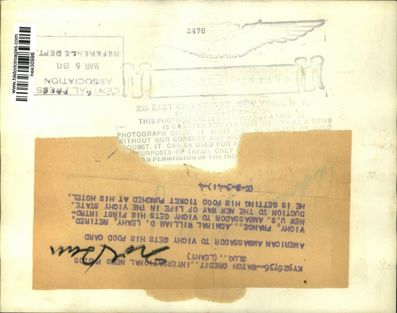 Load image into Gallery viewer, 1941 Press Photo William D. Leahy get hotel food ticket punched, Vichy, France
