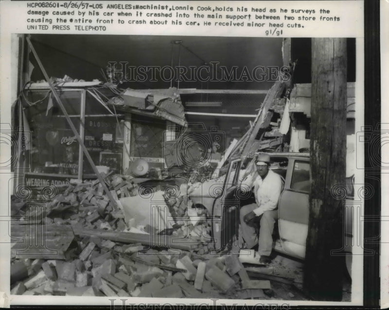 Load image into Gallery viewer, 1957 Press Photo Machinist Lonnie Cook after his car crashed into main support
