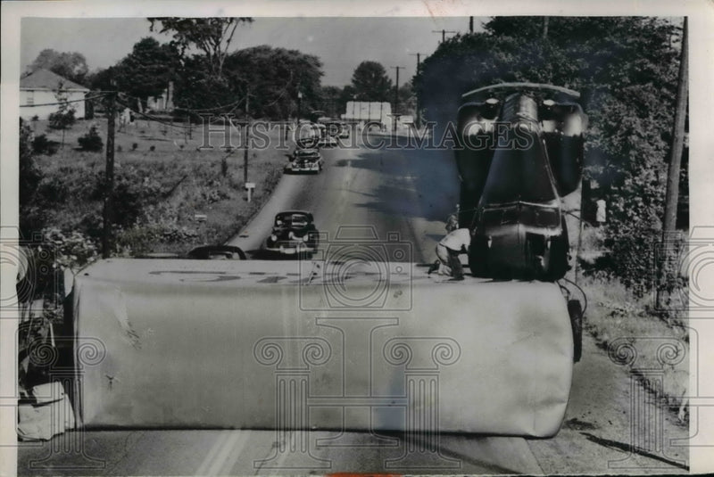Load image into Gallery viewer, 1953 Press Photo Driver R.C Warner peers into Jumbled Interior of Cab
