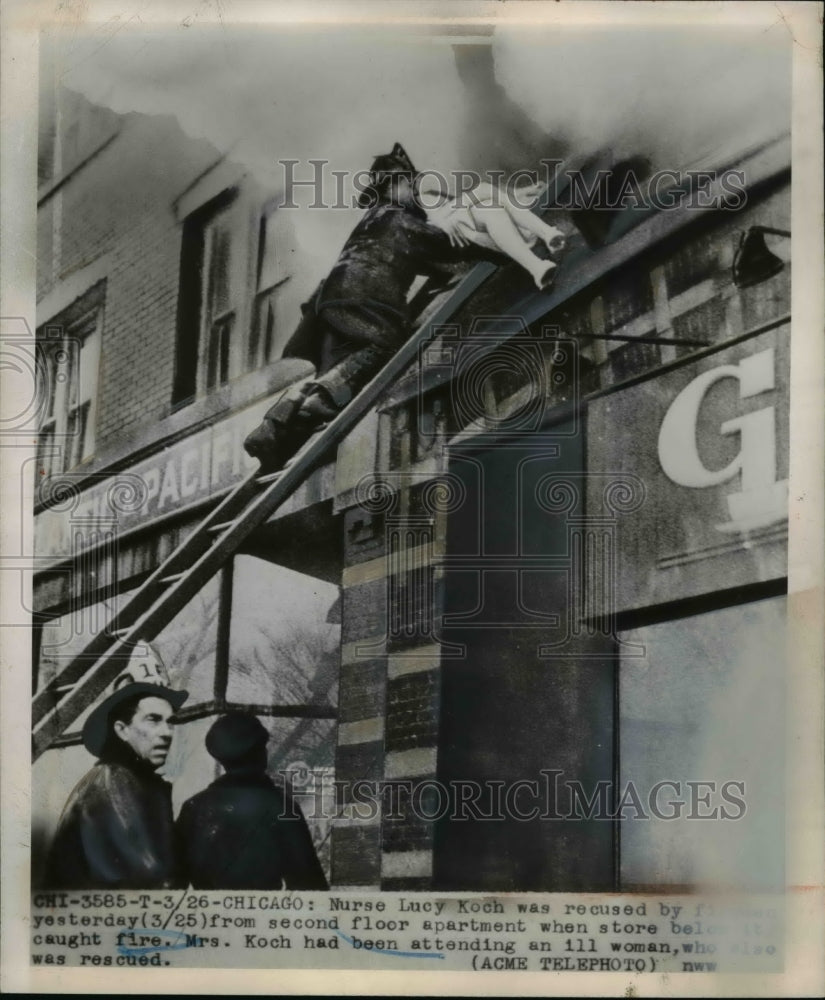 1949 Press Photo of Chicago firemen rescuing a woman. - nee35482