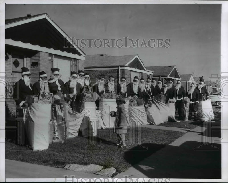 Load image into Gallery viewer, 1957 Press Photo if Roseann Kuchar in front 19 Santa's
