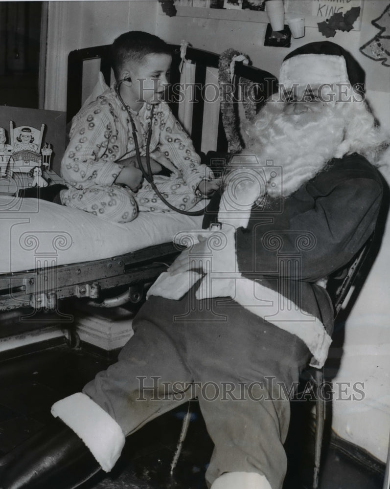1956 Press Photo Dr. Andrew F. Lorinez gets checked by Richard Kelly - nee37019