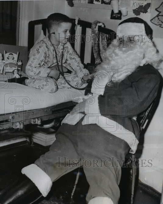 1956 Press Photo Dr. Andrew F. Lorinez gets checked by Richard Kelly - nee37019