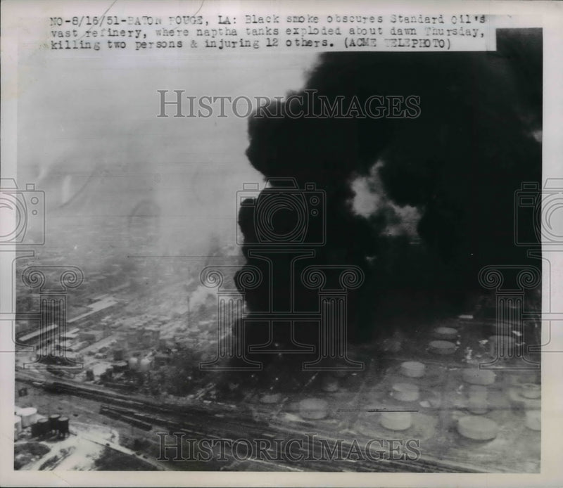 Load image into Gallery viewer, 1951 Press Photo Black smoke obscures Standard Oil's vast refinery - nee37380
