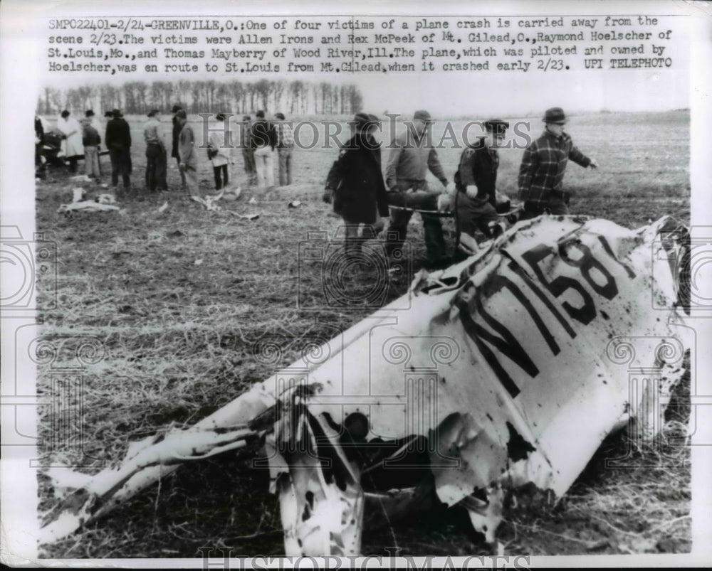 1961 Press Photo Plane Crash Victim Carried Away from Scene in Greenville, Ohio