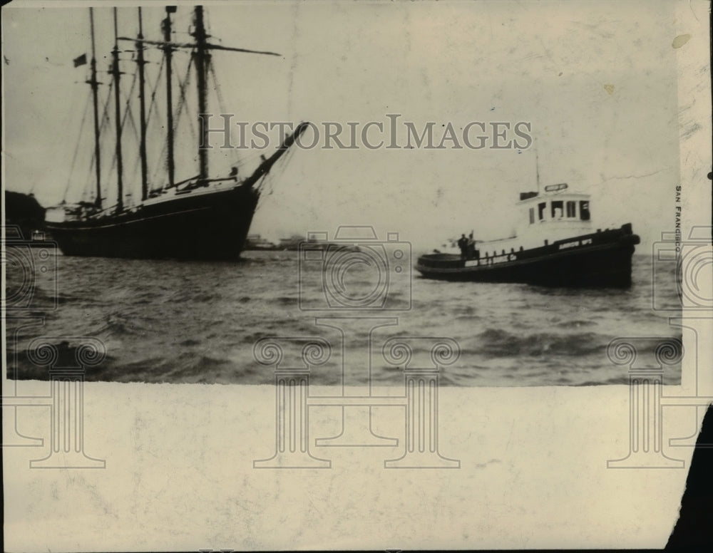 1930 Press Photo of a tug boat and sail boat in a harbor. - nee39036