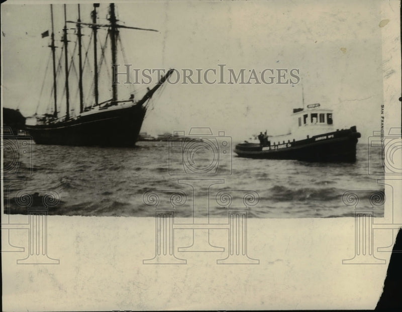 Load image into Gallery viewer, 1930 Press Photo of a tug boat and sail boat in a harbor. - nee39036
