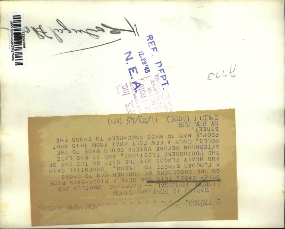 1945 Press Photo Man Piggybacks Through Portugal Storm - nee39531