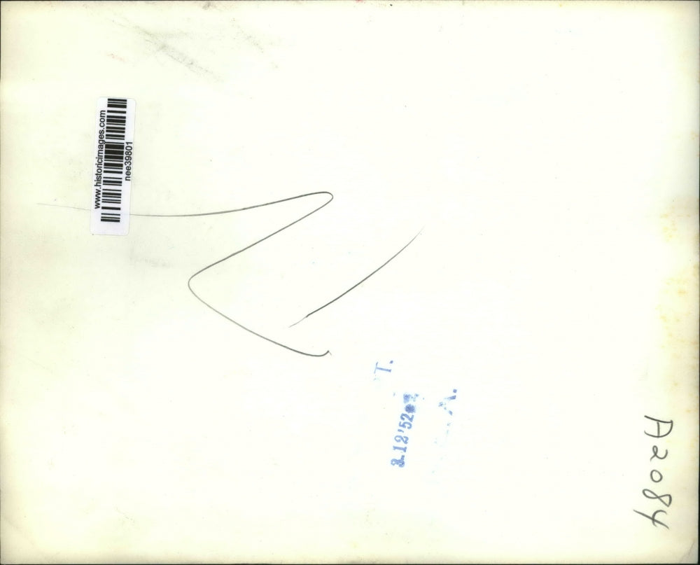 1952 Press Photo Firemen and a survivor during a fire in downtown Montreal