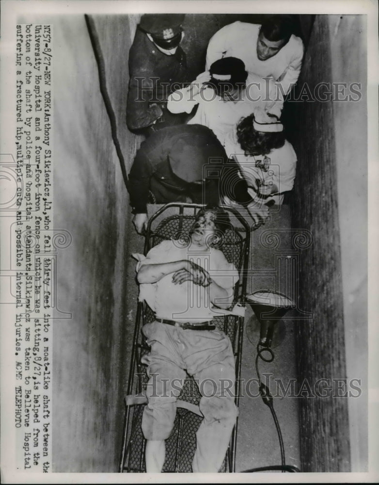 1951 Press Photo Anthony Slikiewicz,is helped by police and hospital attendants