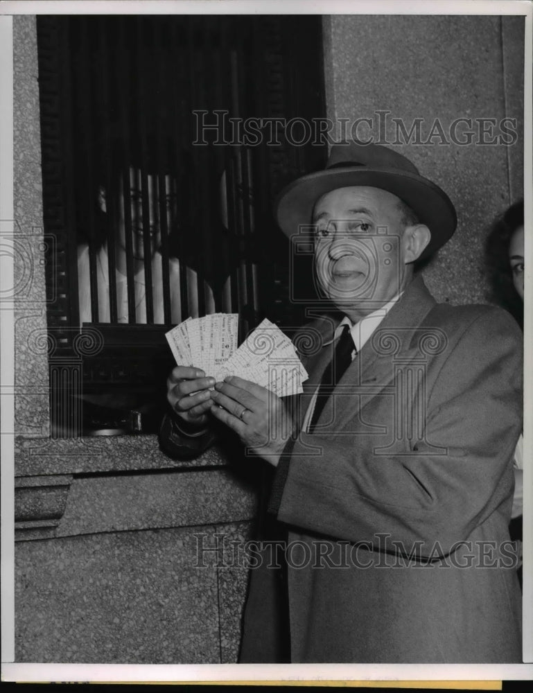 Load image into Gallery viewer, 1951 Press Photo George Krans buys ten passes from Illinois Central - nee40386
