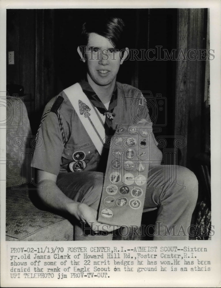 Load image into Gallery viewer, 1970 Press Photo James Clark show off some of the merit badges he has won
