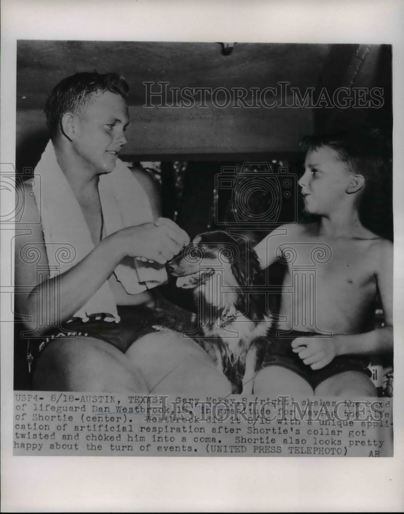 Load image into Gallery viewer, 1954 Press Photo Gary McKay shook hands of Dan Westbrook after saving Shortie,TX
