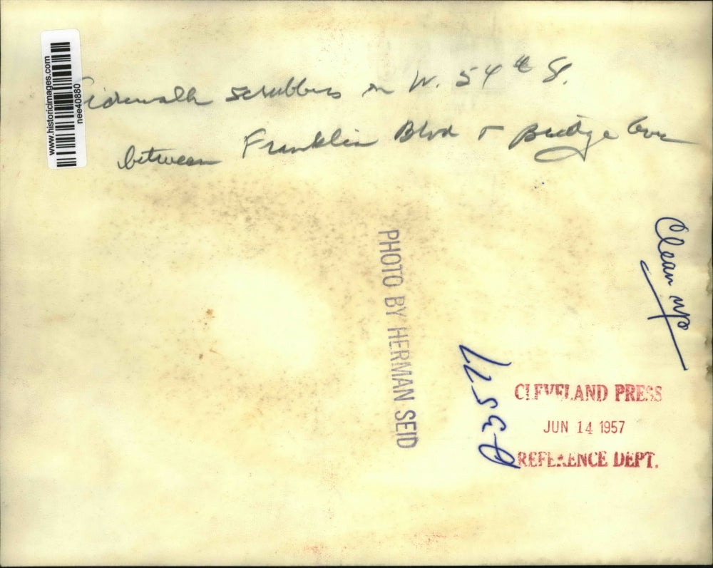 1957 Press Photo Family Cleaning sidewalk - nee40880