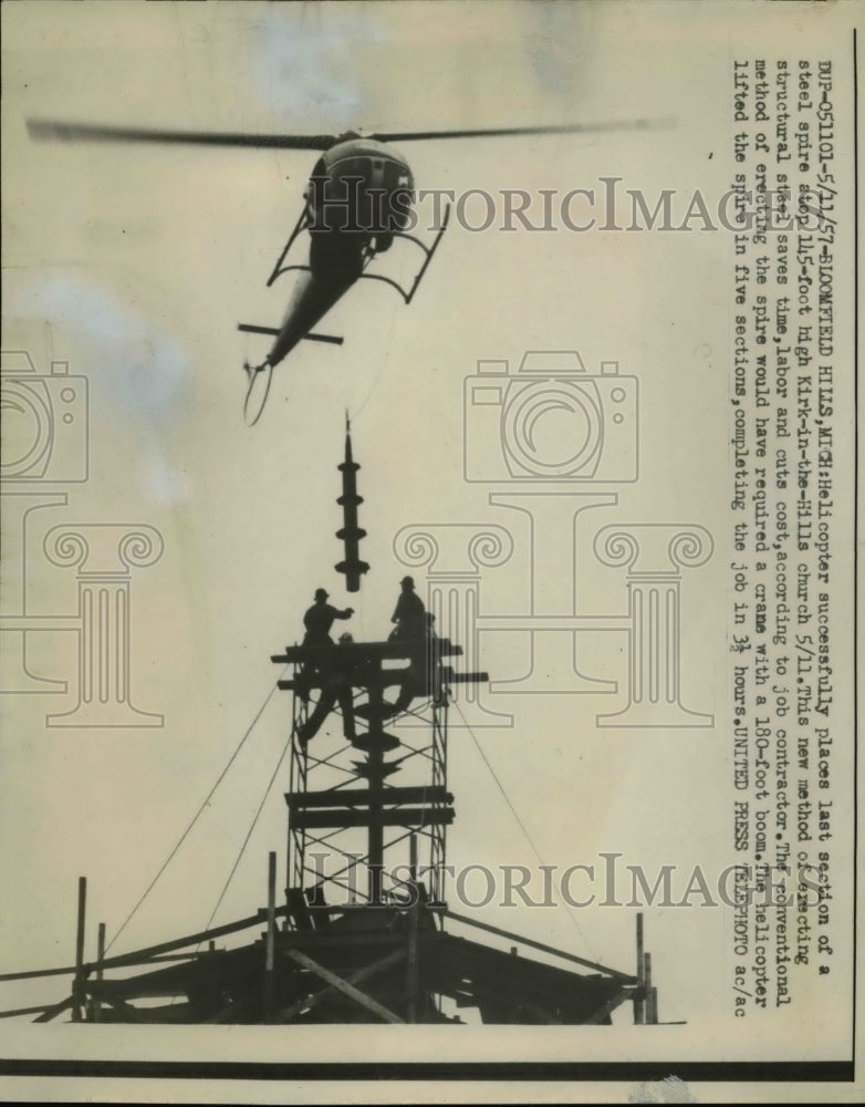 1957 Press Photo Bloomfield Hills Mich Helicopter lifts last section of spire