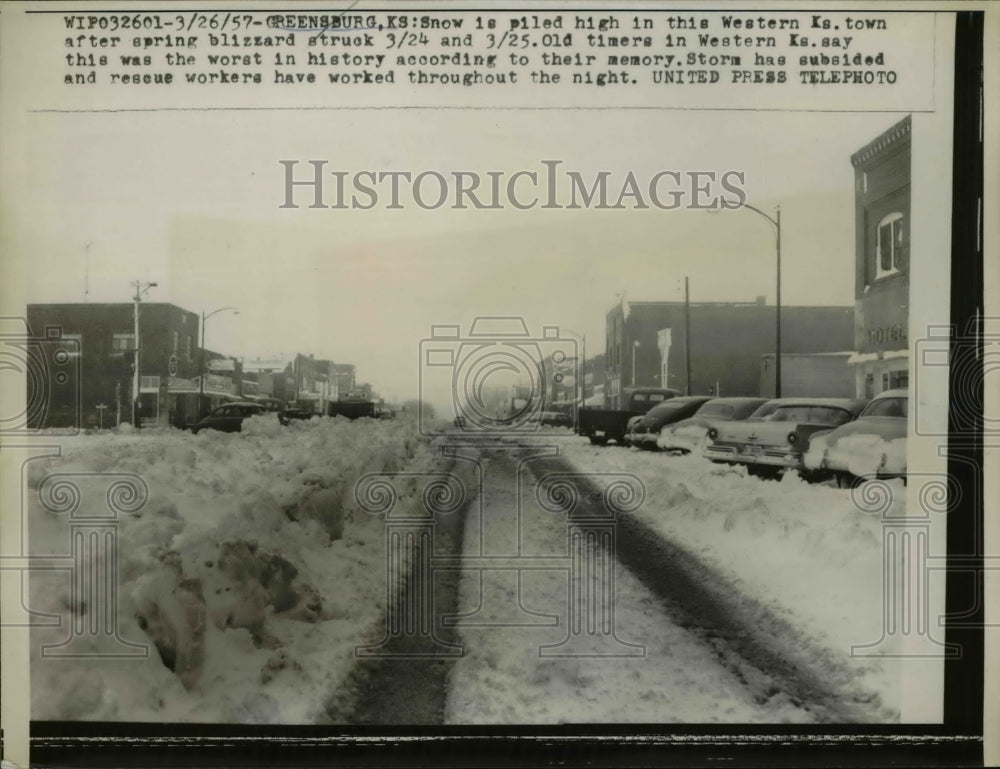 1957 Press Photo of snow piled on a street in Greenburg, Kansas. - nee44796