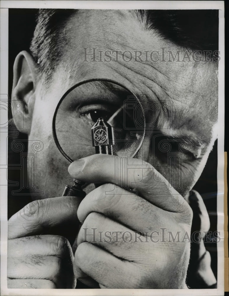 1955 Press Photo Dr. H. Tracy Hall Looks Diamond-Tipped Tool w Magnifying Glass