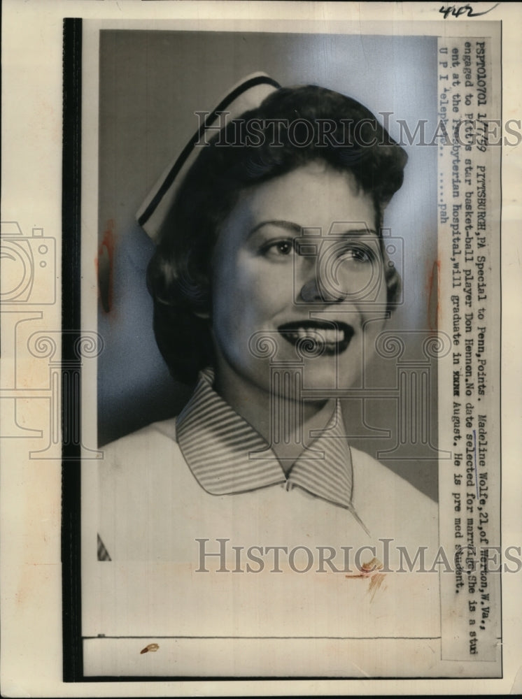 Load image into Gallery viewer, 1959 Press Photo Madeline Wolfe, engaged to basketball play Don Hennon
