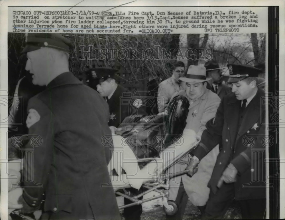1959 Press Photo Fire Captain Don Neuses Carried on Stretcher After Ladder Fall