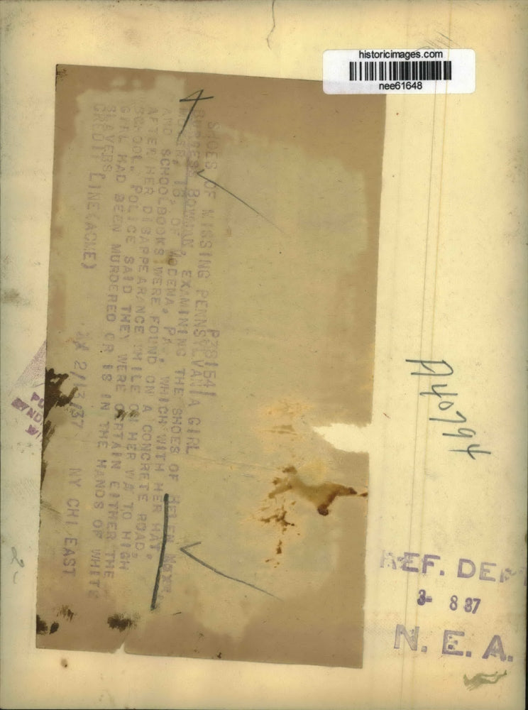 1937 Press Photo Burgess Bowman examines shoes of Helen Moyer. - nee61648