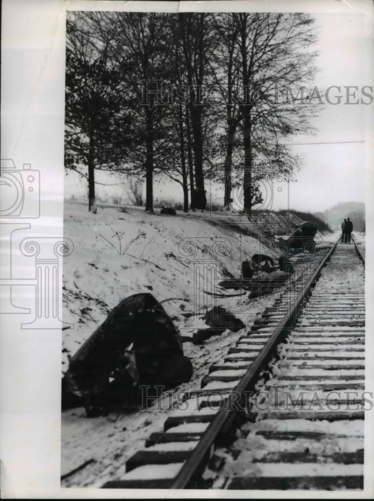 1956 Press Photo Wreckage strewn along right of way after auto skidded.