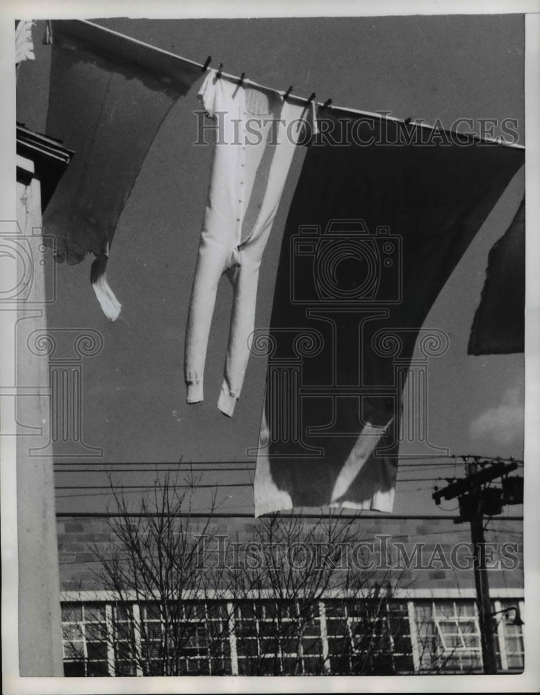 Load image into Gallery viewer, 1958 Press Photo Rutland Vt Winter draws to close as long johns make last wash.
