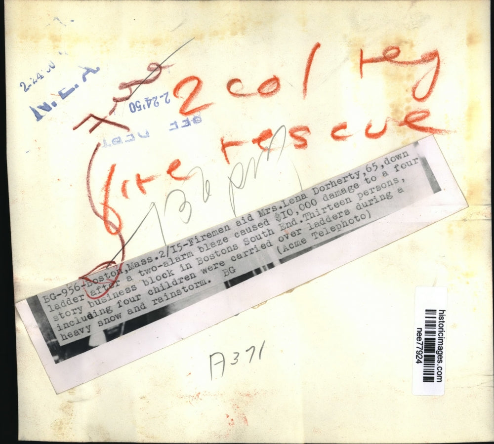 1950 Press Photo Mrs Lena Dorherty Rescued from 2 Alarm Fire in Boston