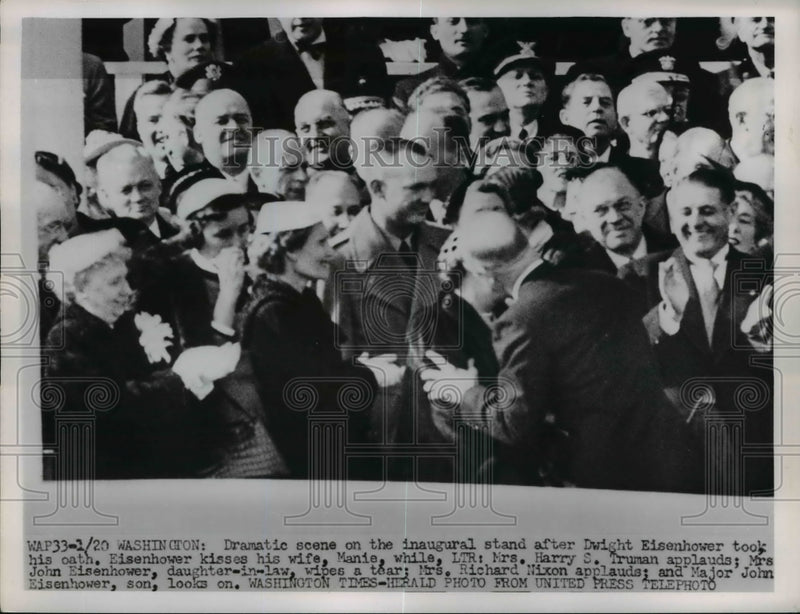Load image into Gallery viewer, 1953 Press Photo Inaugural scene in DC of President Eisenhower kissing Mamie
