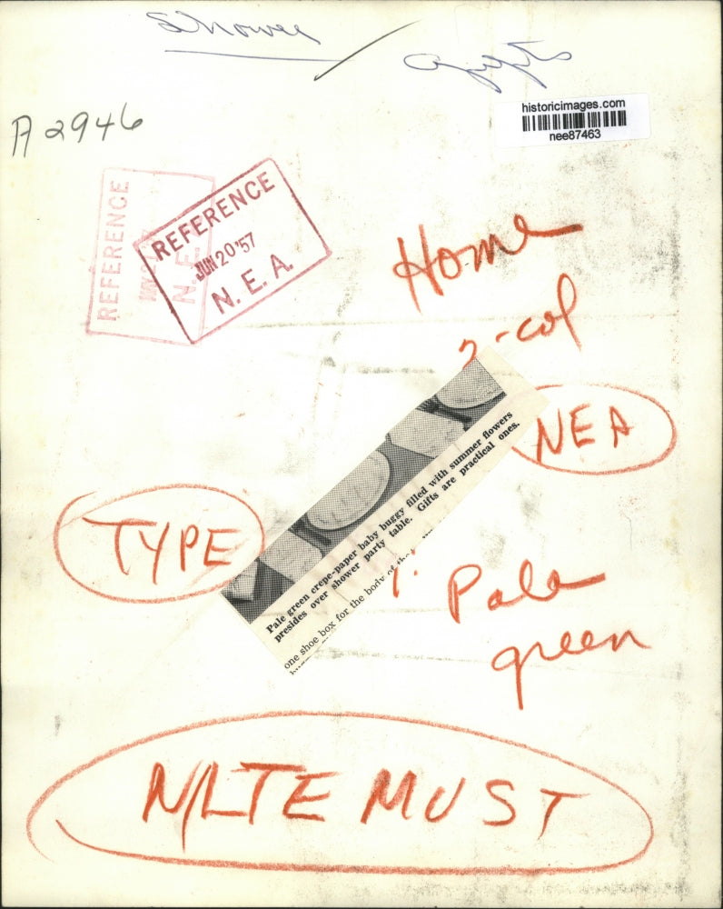 1957 Press Photo A woman preps a display for a shower party at her home