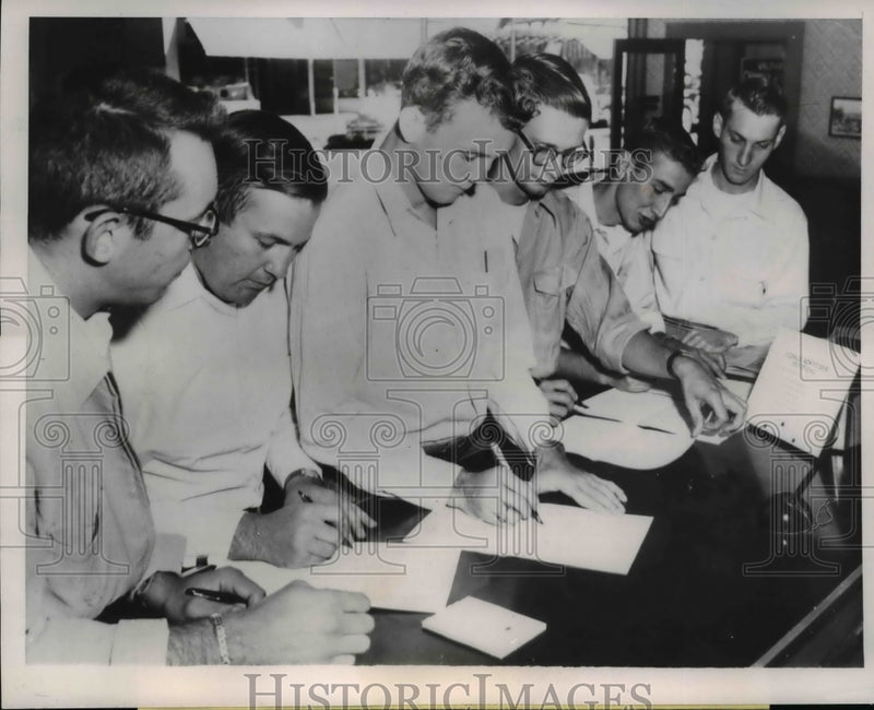 Load image into Gallery viewer, 1953 Press Photo Omega Chi Beta Fraternity signs petition for George Schreiber
