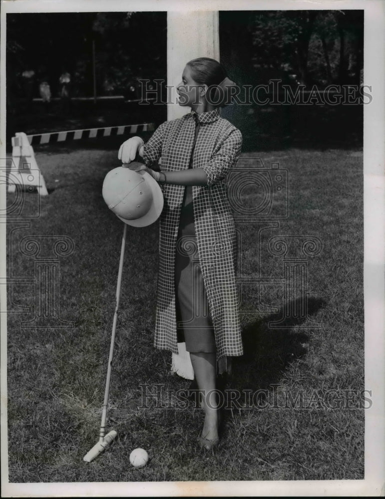 Load image into Gallery viewer, 1956 Press Photo A woman models a coat outfit at a cricket field - nee89732
