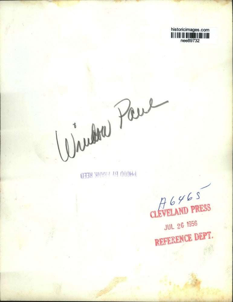 1956 Press Photo A woman models a coat outfit at a cricket field - nee89732