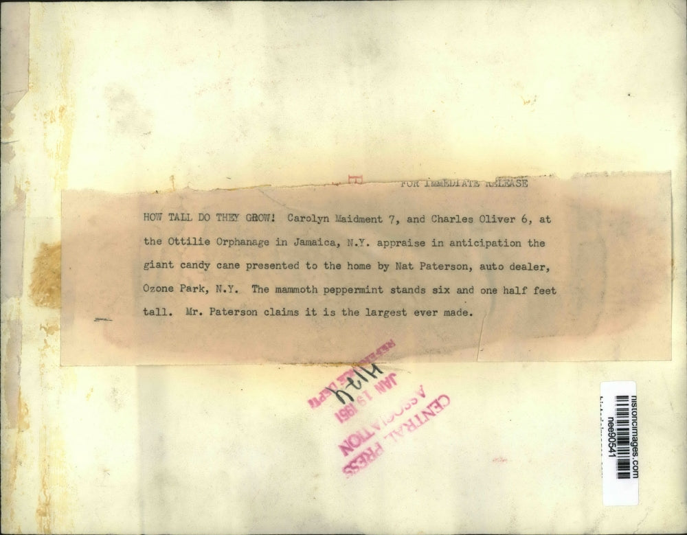 1951 Press Photo Children at Ottilie Orphanage with giant candy Cane - nee90541