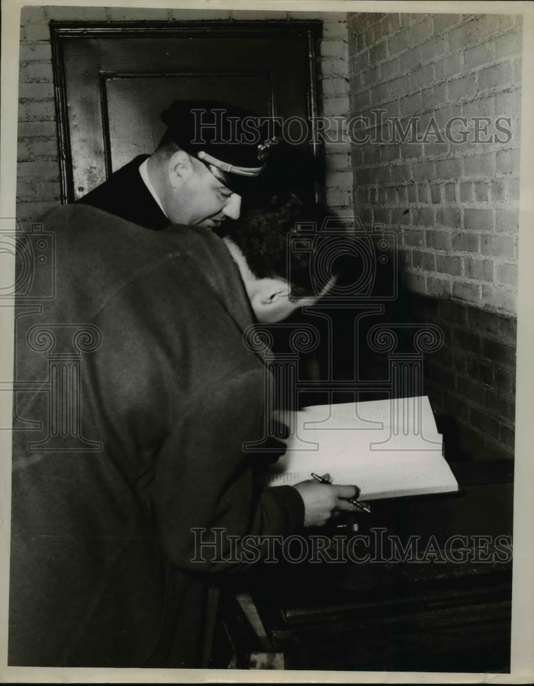 Load image into Gallery viewer, 1951 Press Photo Capt Ray Shillat &amp; Sam Gawo examine register book - nee92968
