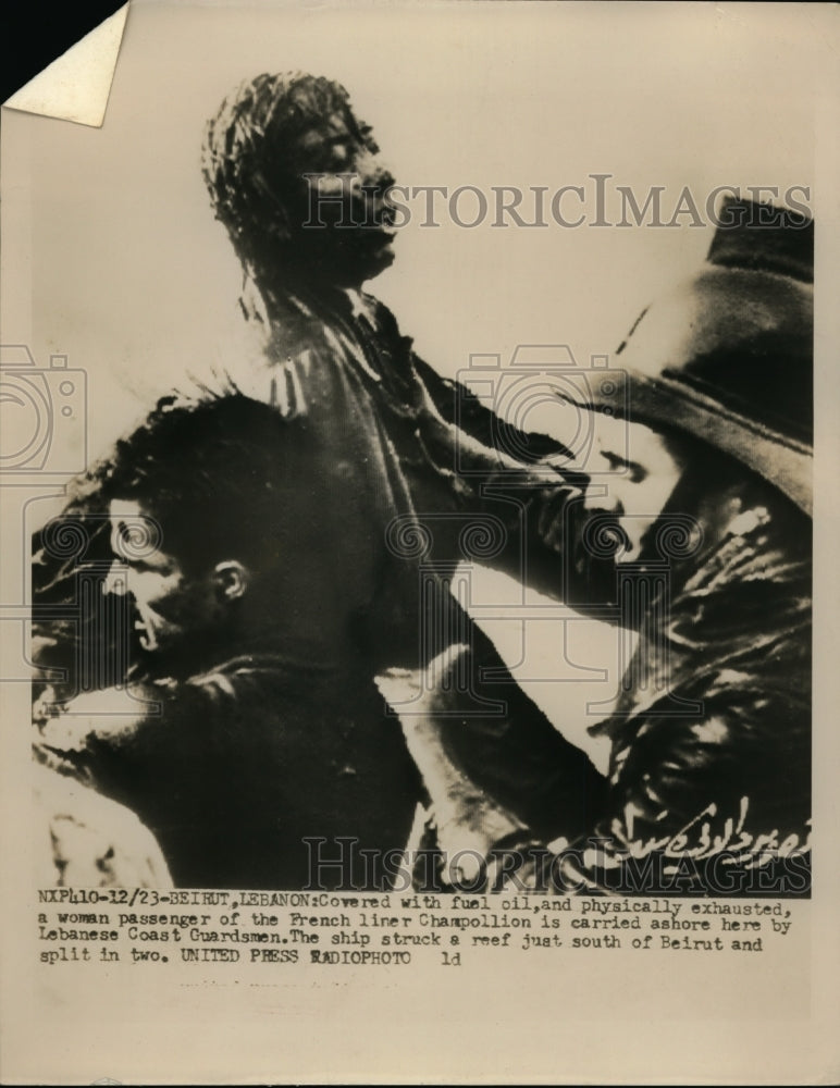 Load image into Gallery viewer, 1952 Press Photo Woman Covered with Fuel Is Carried By Lebanese Coast Guardsmen
