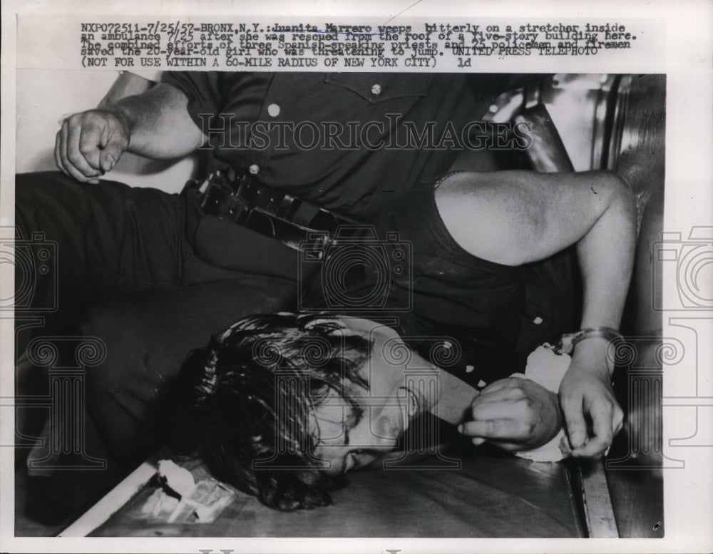 1957 Press Photo Juanita Marrero rescue from the roof of a five story Bldg in NY