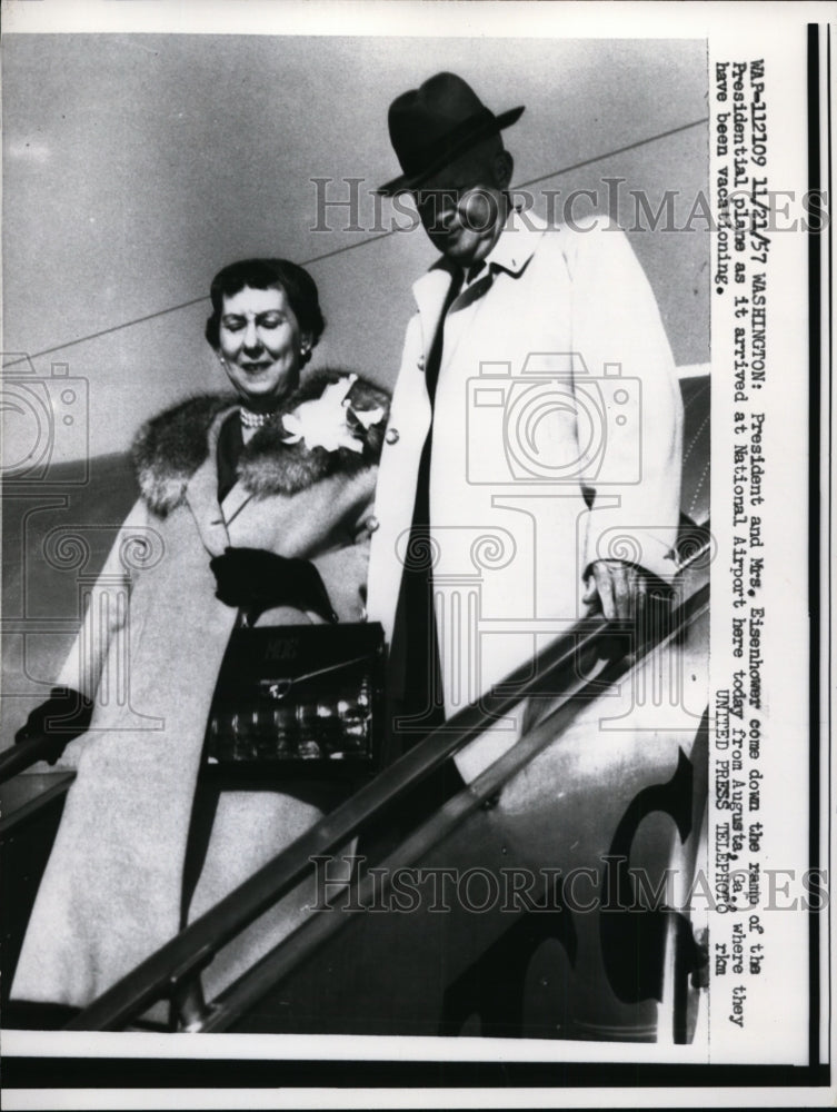 Load image into Gallery viewer, 1957 Press Photo President &amp; Mrs Eisenhower come down ramp of Presidential plane
